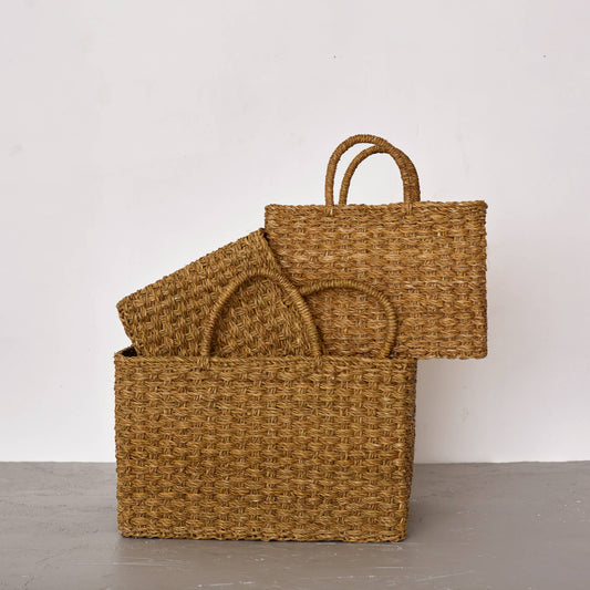 Set of woven baskets on a plain background