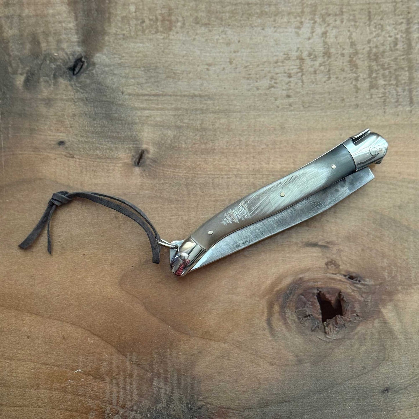 Forge de Laguiole Tradition 11 cm Pocket Knife with Cattle Horn Handle and Brut De Forge Blade