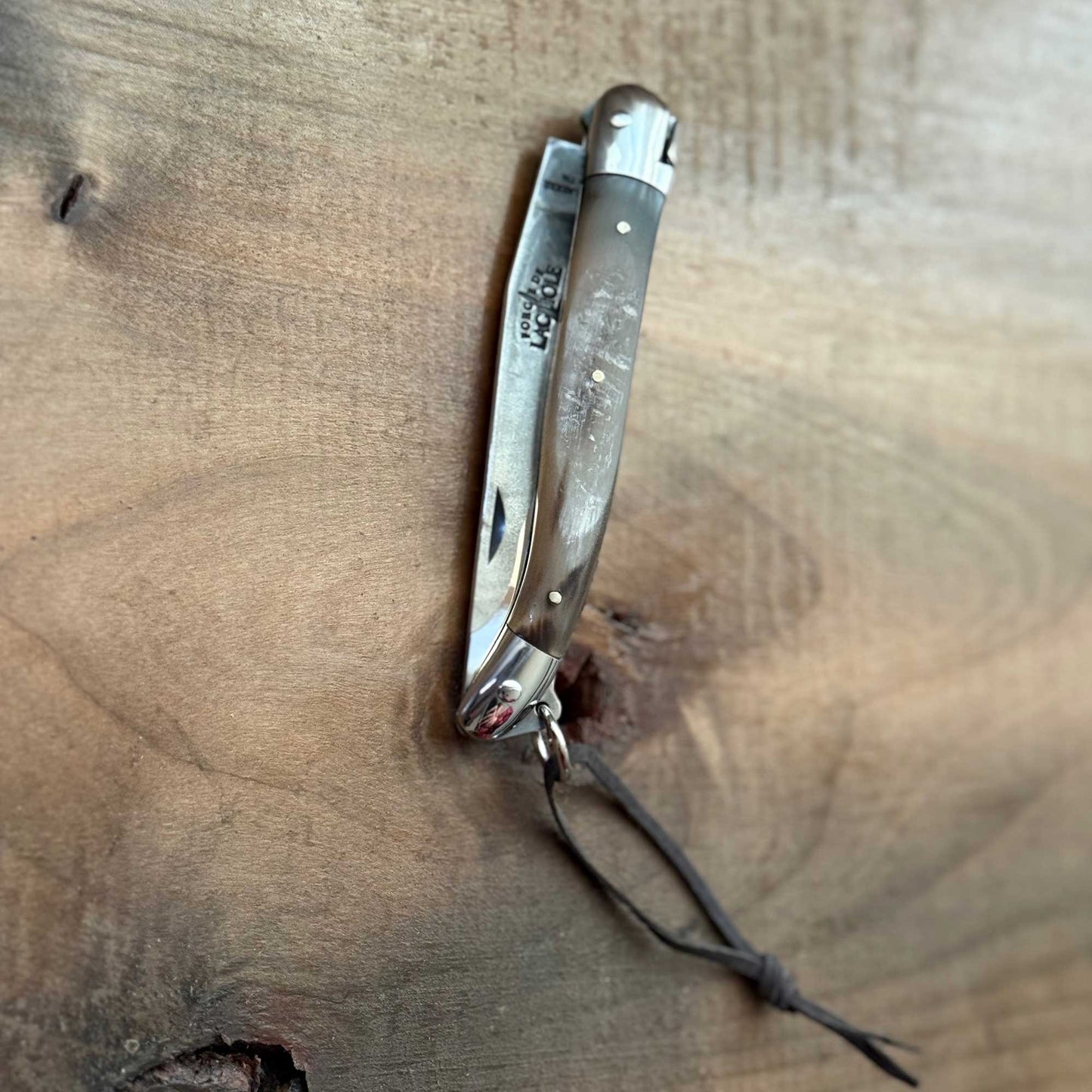 Forge de Laguiole Tradition 11 cm Pocket Knife with Cattle Horn Handle and Brut De Forge Blade