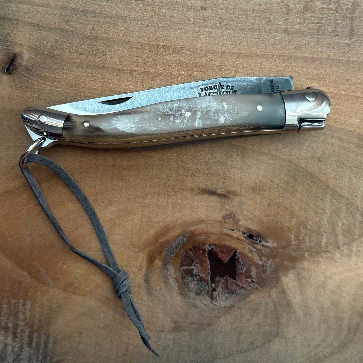 Forge de Laguiole Tradition 11 cm Pocket Knife with Cattle Horn Handle and Brut De Forge Blade