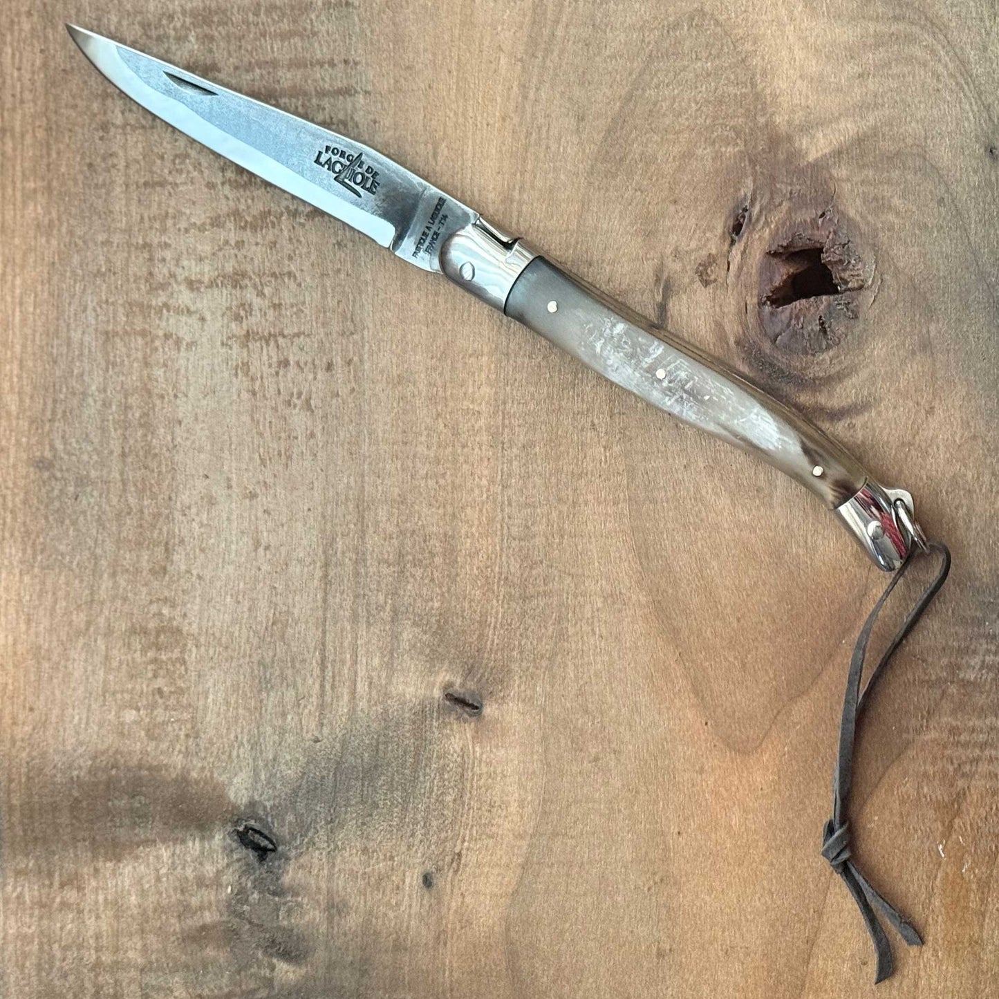 Forge de Laguiole Tradition 11 cm Pocket Knife with Cattle Horn Handle and Brut De Forge Blade