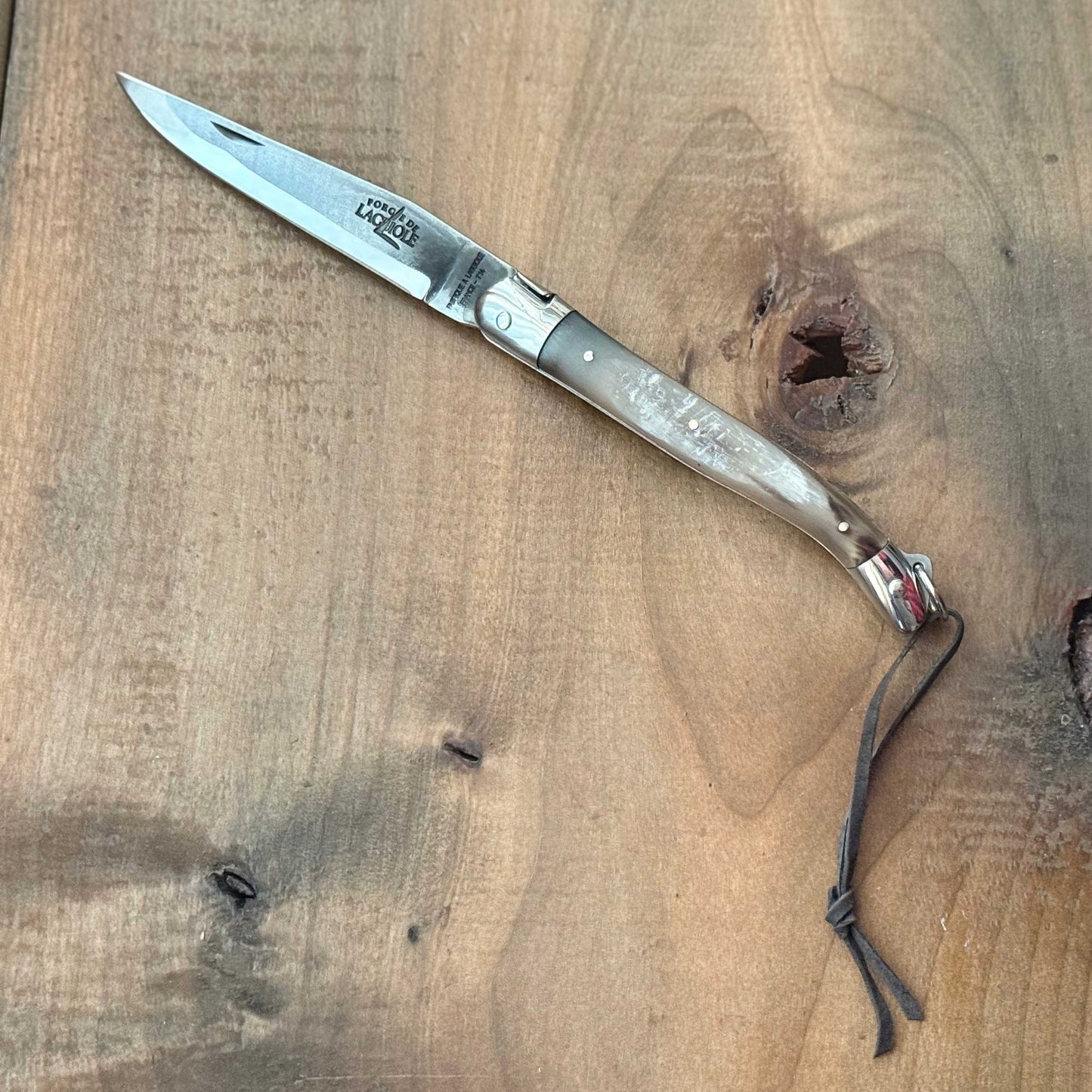Forge de Laguiole Tradition 11 cm Pocket Knife with Cattle Horn Handle and Brut De Forge Blade
